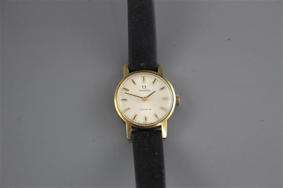A ladys steel and gold plated Omega manual wind wrist watch, on associated leather strap.